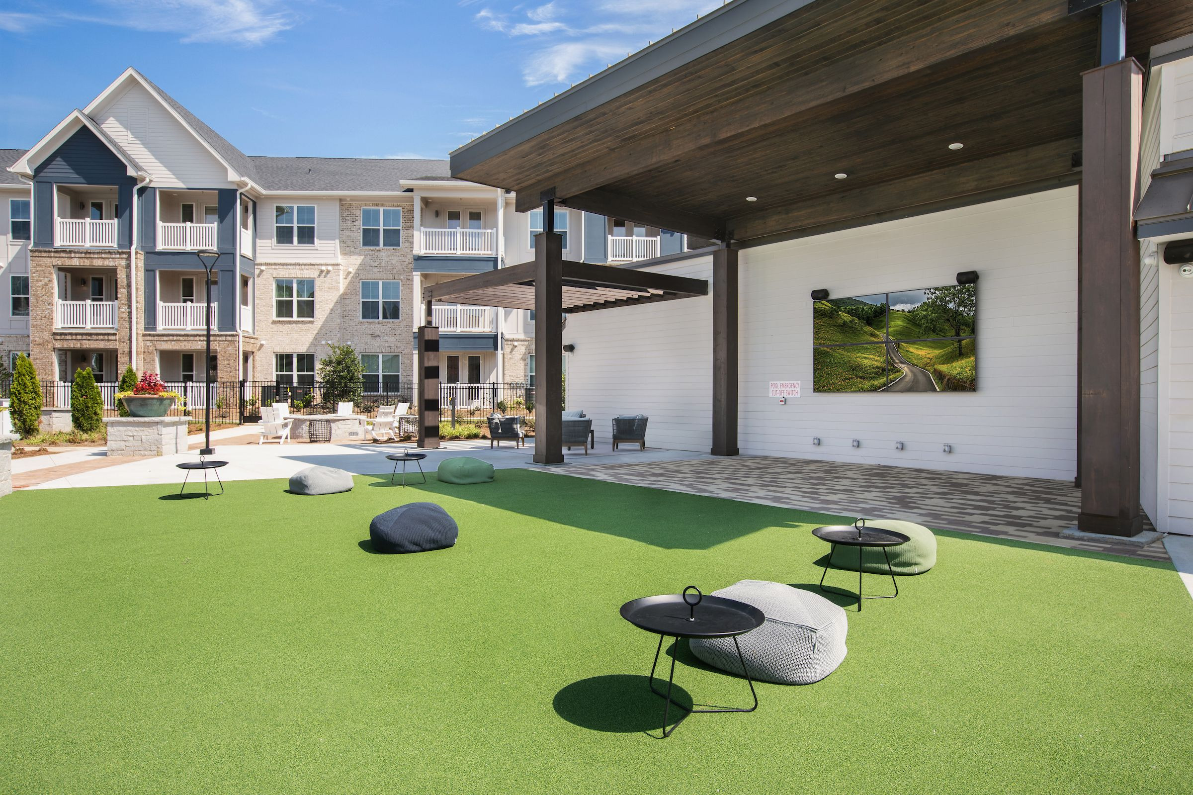 Celadon on Club’s outdoor lounge and apartment buildings.