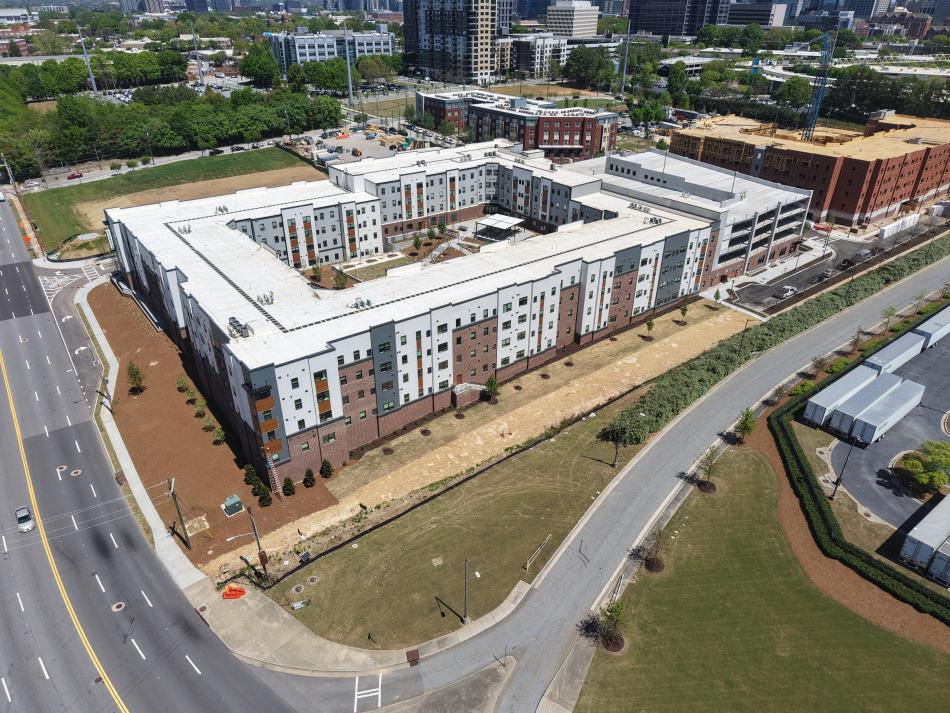 Completed Legacy at Herndon Square buildings along Northside Drive; the next phase is under construction at right.