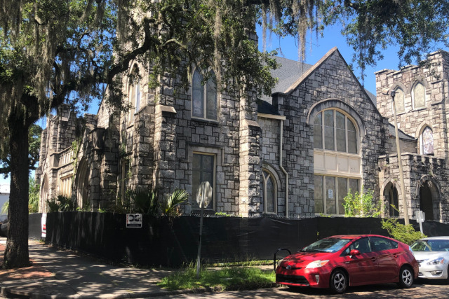 Street view of the historic stone church preserved within Starland Village on Bull Street.