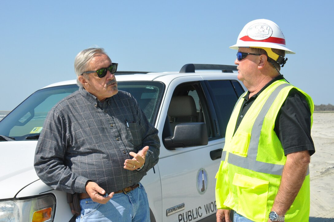 U.S. Army Corps of Engineers staff discuss beach renourishment on Tybee Island during the district's 2018 renourishment work.