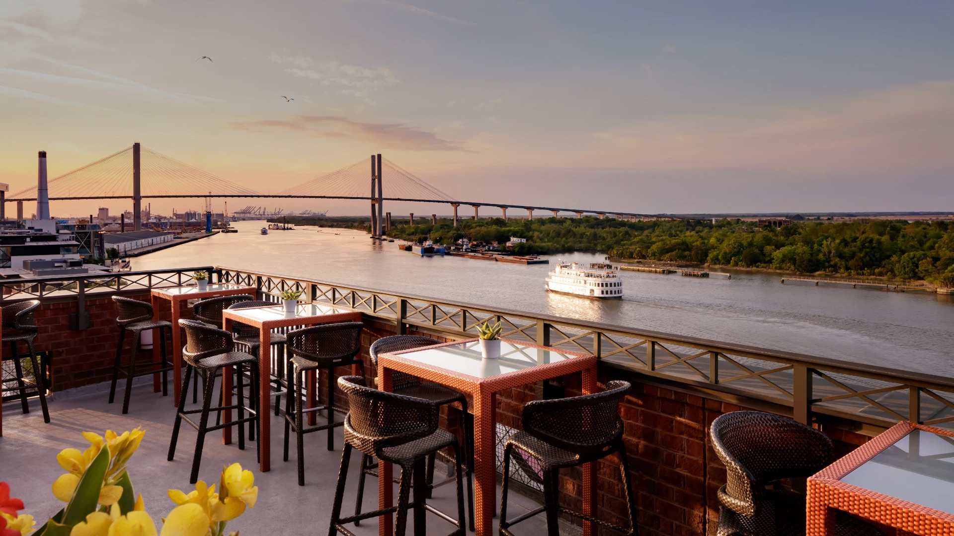 Hotel Orielle's rooftop terrace overlooking the Savannah River and Talmadge Memorial Bridge.
